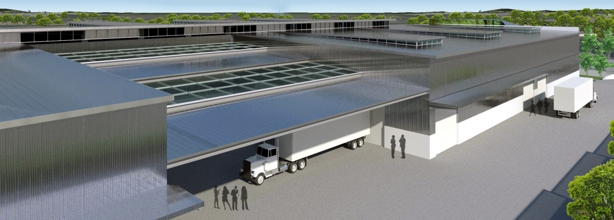 Warehouse loading bay area with ample skylights, captured from an elevated perspective