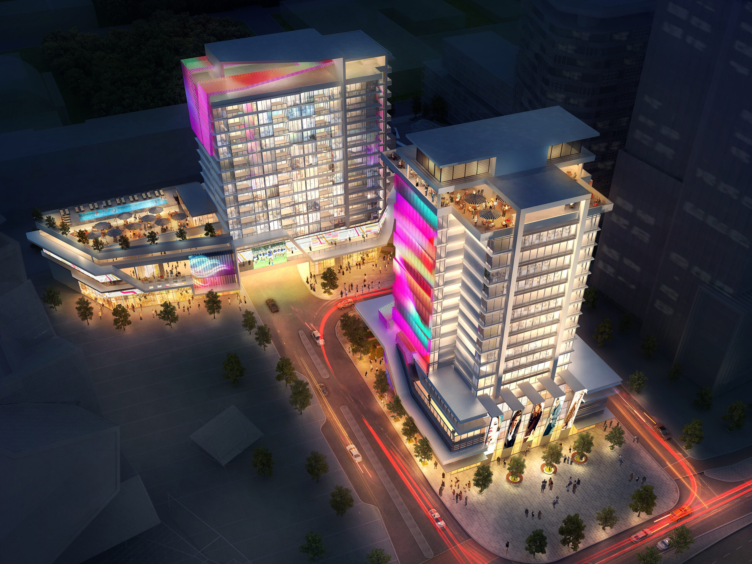 Hotel building with an illuminated facade extending the entire length, projecting vibrant colors across its face. The retail tenancies on the ground level of the podium are also illuminated, bustling with people. The image captures a lively scene at dusk