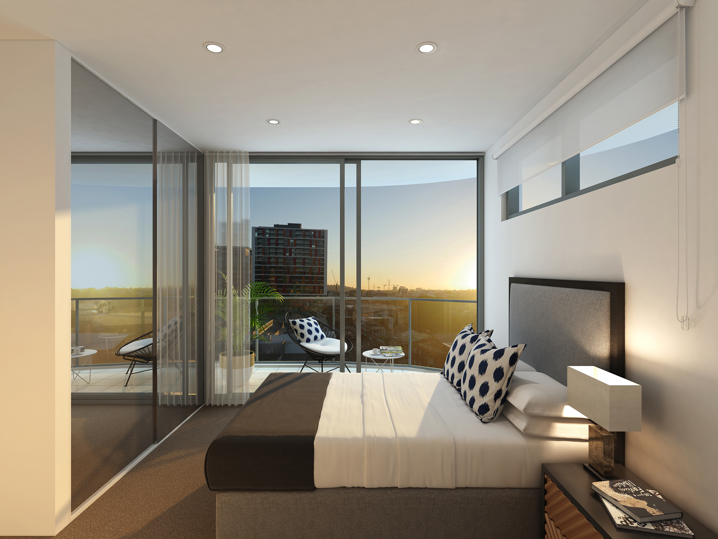 Bedroom suite of the winn with floor to ceiling glazing and a view out towards sunset