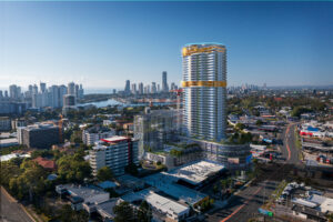 Aerial view of Monarch Place development featuring a 6-story podium with integrated commercial and retail spaces, as well as aged care living spaces. The tower rises 40 stories high, adorned with gold accents and blue glazing. A floating blue halo adds a distinctive touch above the tower.